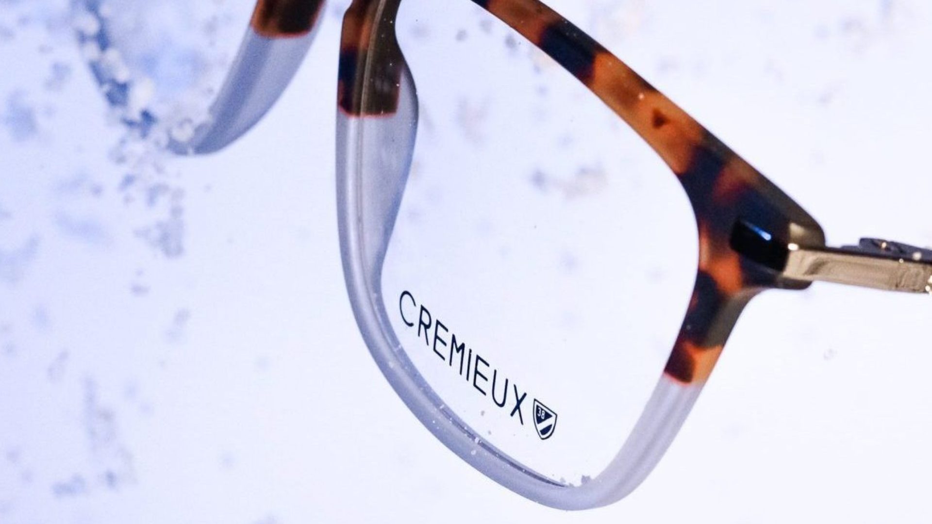 Cremieux eyeglasses on a water background